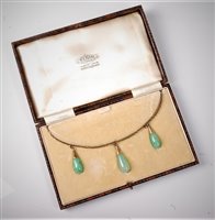 Lot 2211 - An Edwardian jade necklace, the three...