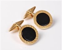 Lot 2339 - A pair of 18ct and onyx cufflinks, possibly by...