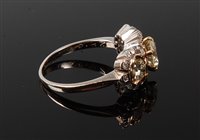 Lot 2228 - A three stone diamond cluster ring, the three...