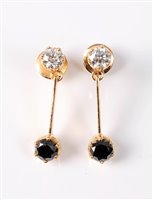 Lot 2336 - A pair of black and white diamond earrings,...