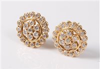Lot 2261 - A pair of diamond flowerhead cluster earrings,...