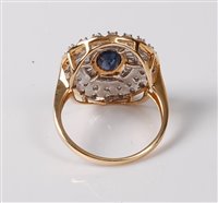 Lot 2246 - A sapphire and diamond cluster ring, the oval...