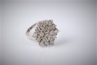 Lot 2230 - An 18ct gold diamond cluster ring, the...