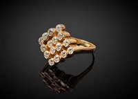 Lot 2303 - An 18ct diamond cluster ring, the round...