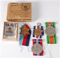 Lot 311 - A group of four WW II medals to include...