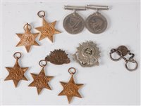 Lot 312 - A group of five WW II medals to include...