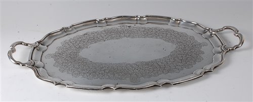 Lot 2145 - A modern silver twin handle salver, of oval...