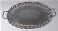 Lot 2145 - A modern silver twin handle salver, of oval...