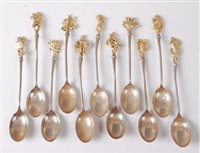 Lot 2167 - A set of eleven white metal and gilt metal...