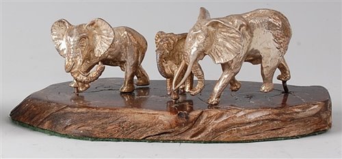 Lot 2158 - A Middle Eastern cast silver small elephant...