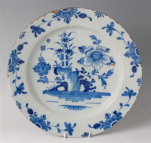Lot 2077 - An 18th century English Delft charger, blue...