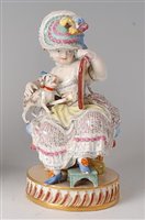 Lot 2097 - A Meissen porcelain figure of a seated girl in...