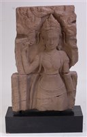 Lot 2464 - A South East Asian carved sandstone stele,...