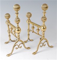 Lot 2427 - A pair of early 19th century brass andirons,...