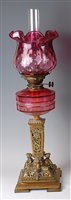 Lot 2423 - A Victorian cast brass pedestal oil lamp,...