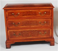 Lot 2637 - A figured walnut and inlaid three drawer chest,...