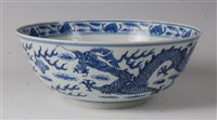 Lot 2449 - A Chinese export blue and white dragon bowl,...