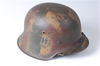 Lot 642 - A post WW II German M40 pattern steel helmet...