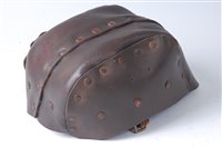 Lot 643 - A British 1916 pattern Tank Corps helmet of...