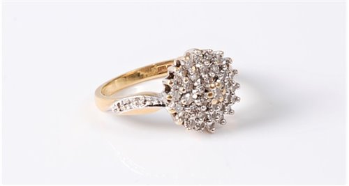 Lot 2565 - An 18ct diamond cluster ring, the diamond...