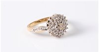 Lot 2565 - An 18ct diamond cluster ring, the diamond...