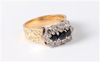 Lot 2549 - An 18ct sapphire and diamond cluster ring, the...