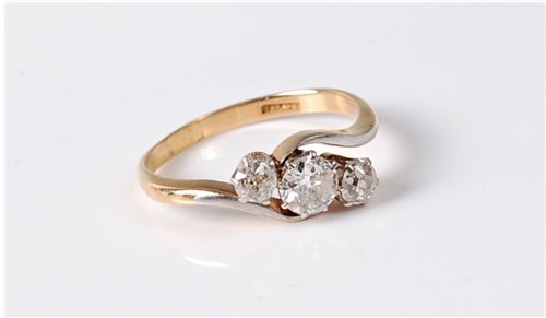 Lot 2548 - An 18ct three stone diamond ring, the three...