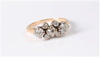 Lot 2539 - An '18k' seven stone diamond ring, the central...