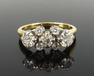 Lot 2544 - A yellow metal seven stone diamond ring, the...