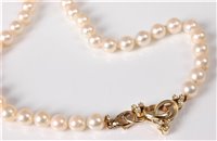 Lot 2586 - A cultured pearl necklace with 14ct diamond...