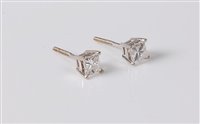 Lot 2613 - A pair of diamond earstuds, the princess cut...