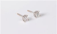 Lot 2613 - A pair of diamond earstuds, the princess cut...