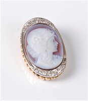 Lot 2501 - A 14ct diamond set cameo pendant, the oval...