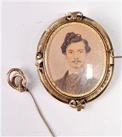 Lot 335 - A hairwork portrait miniature brooch, the oval...