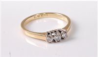 Lot 352 - An 18ct three stone diamond ring, the three...