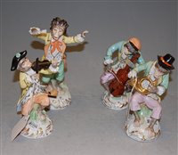Lot 223 - Four Dresden porcelain monkey band figures, to...