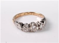 Lot 356 - A three stone diamond ring, the graduated...