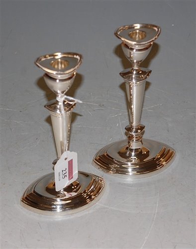 Lot 235 - A pair of silver candlesticks in the Adam...
