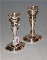Lot 235 - A pair of silver candlesticks in the Adam...