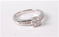 Lot 359 - An '18k' white gold diamond ring, the four...