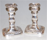 Lot 229 - A pair of late Victorian silver candlesticks,...