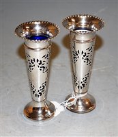 Lot 256 - A pair of Edwardian silver specimen vases with...