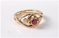 Lot 370 - A ruby and diamond ring, the central round...