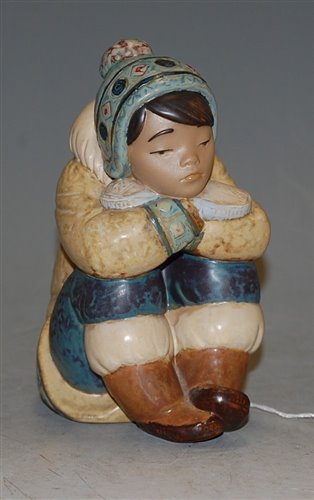 Lot 1 - A Lladro stoneware figure of an Inuit girl,...