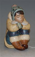Lot 1 - A Lladro stoneware figure of an Inuit girl,...