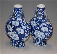 Lot 11 - A pair of Chinese export blue and white moon...