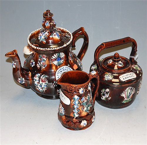 Lot 25 - A Victorian bargeware teapot 'A present from a...