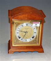 Lot 30 - An Elliot walnut cased mantel clock, having...