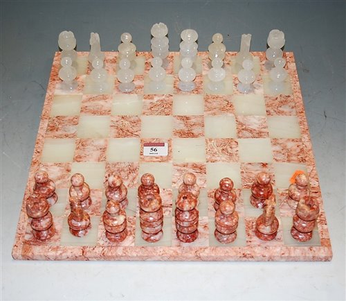 Lot 56 - A modern onyx and marble chess set with board