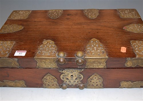 Lot 97 - An Eastern teak and brass bound fitted box